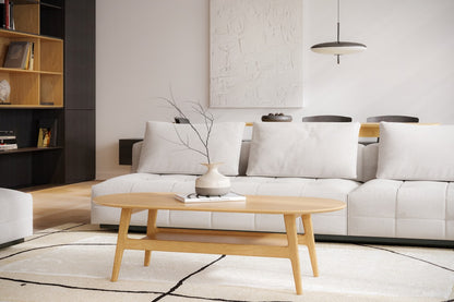 Couchtisch Kodus in hellem Holz des estnischen Herstellers Woodman in einem modernen Wohnzimmer mit hellen Polstermöbeln