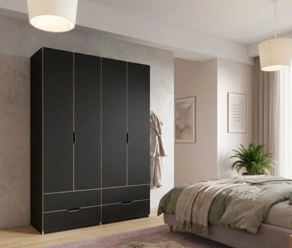 Kleiderschrank NOBLE 4-türig in Schwarz mit von außen zugänglichen Schubladen in einem hellen Schlafzimmer